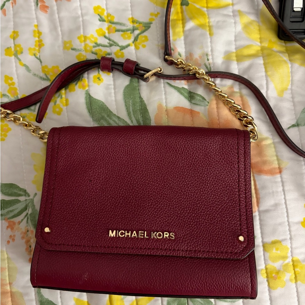 Michael Kors Burgundy Leather Jet Set Flap
Crossbody Bag